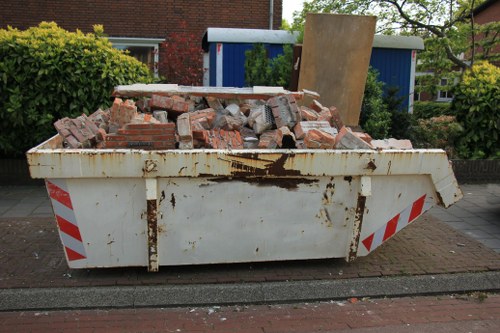 Maidavale waste removal truck in action