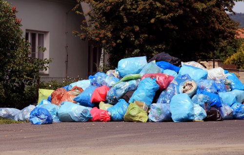Waste segregation bins arranged for removal and recycling